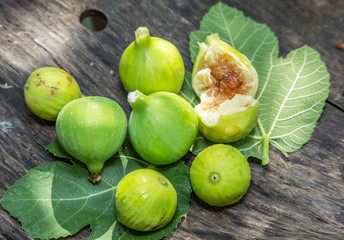 Ripe fig fruits on the wooden table.