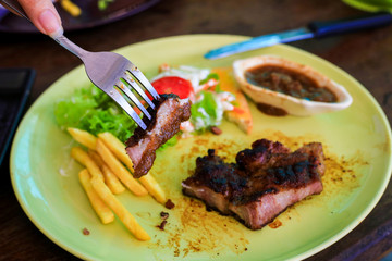 Top view the food steak , Rustic grilled beefsteak with french fries, Grilled beef steak