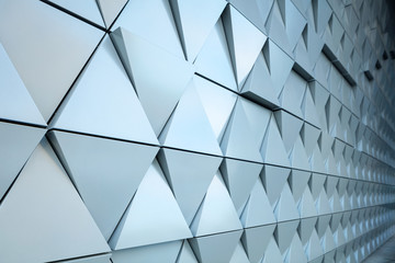 Abstract close-up view of modern aluminum ventilated triangles on facade 