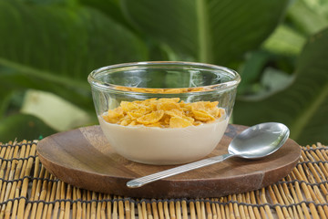cornflakes with milk on the  cup
