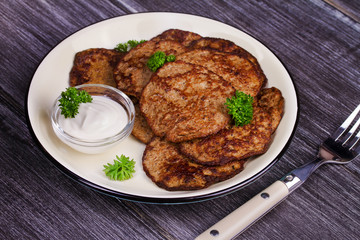 Liver Patties with Sour Cream and Parsley. Liver Cakes or Fritters of Liver. Healthy snack or take-away lunch bites