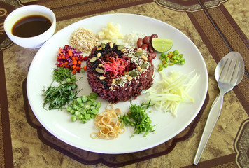 Nasi kerabu - Rice with herbs and vegetables Southen Thai-Style