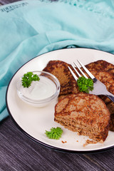 Liver Patties with Sour Cream and Parsley. Liver Cakes or Fritters of Liver. Healthy snack or take-away lunch bites
