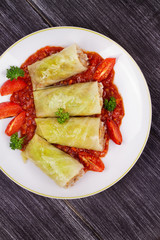 Cabbage rolls with meat, rice and vegetables in tomato sauce. Stuffed cabbage leaves with meat. Dolma, sarma, sarmale, golubtsy or golabki - traditional dish in many countries