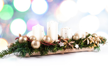 Advent wreath and candles on a Christmas background