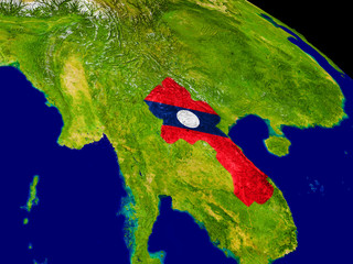 Laos with flag on Earth