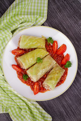 Cabbage rolls with meat, rice and vegetables in tomato sauce. Stuffed cabbage leaves with meat. Dolma, sarma, sarmale, golubtsy or golabki - traditional dish in many countries