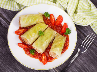 Cabbage rolls with meat, rice and vegetables in tomato sauce. Stuffed cabbage leaves with meat. Dolma, sarma, sarmale, golubtsy or golabki - traditional dish in many countries