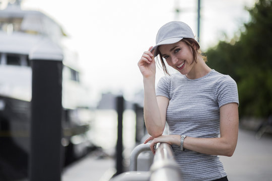 Portrait of smiling woman wearing baseball cap