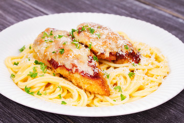 Chicken parmesan and pasta. Chicken breasts and spaghetti