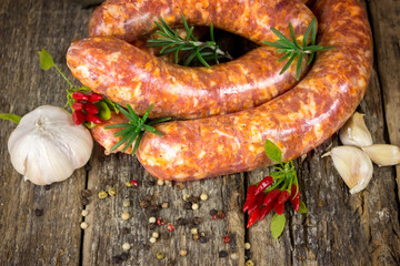 Raw sausages with garlic, rosemary and chili peppers