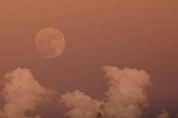 Naklejka premium super full moon in 68 years with clear blue sky cloud daytime for background backdrop use