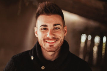 Portrait of attractive guy in a old house