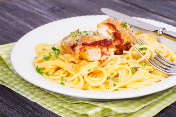 Chicken parmesan and pasta. Chicken breasts and spaghetti