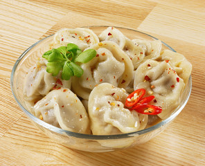 Dumplings and parsley - russian pelmeni - italian ravioli