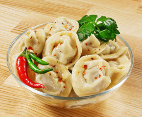 Dumplings and parsley - russian pelmeni - italian ravioli