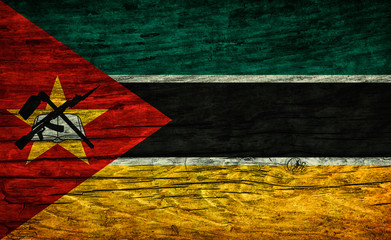 The national vintage flag of Mozambique on wooden surface