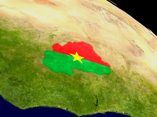 Burkina Faso with flag on Earth