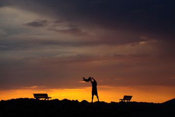 Fototapeta na wymiar father and child on sunset