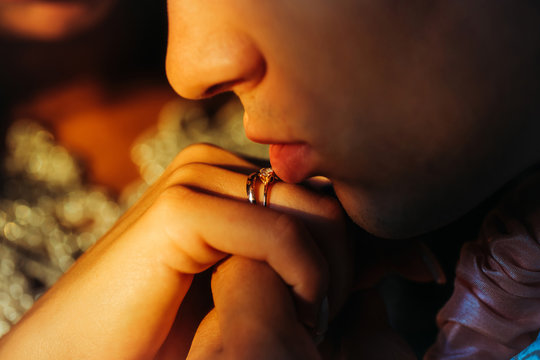 Young grrom holding bridal hand