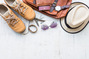 Men's casual outfits with man clothing, travel preparations and accessories on white wooden...