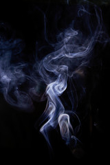 White smoke movement on black background.