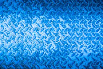 Blue metal non slip surface background.