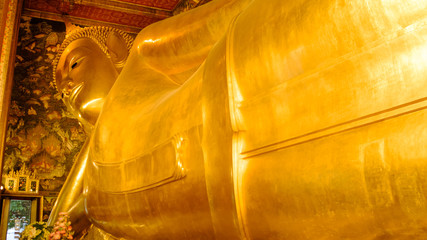Reclining Buddha gold statue in hall, Wat Phra Chetupon Vimolmangklararm (Wat Pho) temple, Thailand. Photo taken on: 2 November , 2016