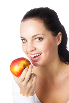 Portrait of young happy smiling woman with apple, isolated on wh