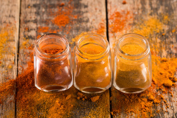 Spice. Various Spices over Wooden Background. paprika, turmeric, curry