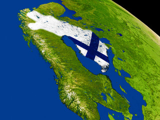 Finland with flag on Earth