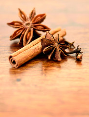 Star anise, cinnamon and cloves on a wooden table. christmas bakery or cooking.