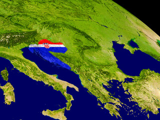 Croatia with flag on Earth