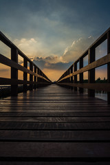 Wooden beach walkway in the evening, a nature trail in Bangkok, Thailand.