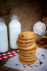 Homemade oatmeal cookies with chocolate and milk