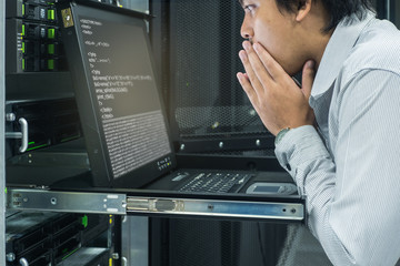 System administrator serious working in data center