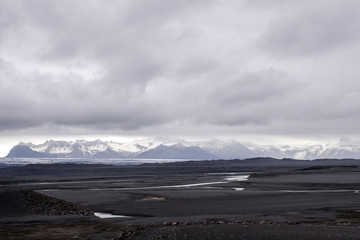 Fototapeta na wymiar Epic Landscape Iceland grey rocks river glacier