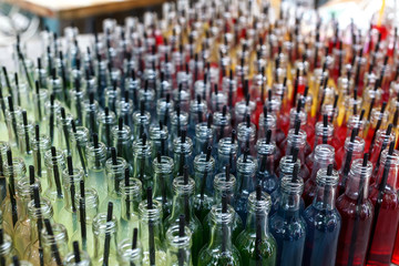 Fototapeta premium Colorful cocktails, shots with straws in small glass bottles