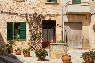 Fototapeta na wymiar charming mediterranean street decorated with flowers
