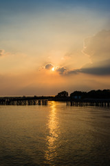 Silhouettes Sunset by the sea coastal Bangkok, Thailand