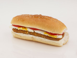 hamburger with cutlet and egg on a white background with reflection