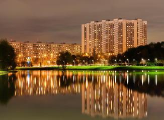 Fototapeta na wymiar Altufievo district in Moscow night reflections background