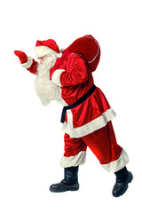 Santa Claus carries a bag with gifts.