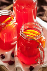 Fototapeta na wymiar hot cranberry tea with orange cinnamon warming drink