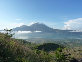 Fototapeta na wymiar Beautiful sunrise on the volcano. View of Agung volcano from the peak of Batur. Indonesia, Bali.