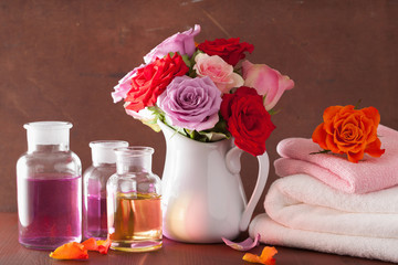 Obraz na płótnie Canvas essential oil and rose flowers aromatherapy spa perfumery