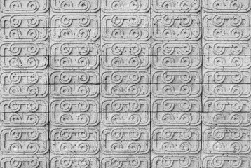 Closeup brick pattern at old brick stone wall textured background in black and white tone