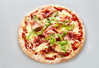 Delicious Italian pizza with parma ham and rocket