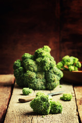 Pieces of broccoli, rustic style, old wooden background, selecti