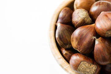 Chestnuts in a bowl isolated on white background

